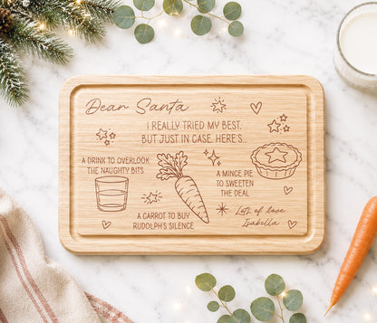 A funny Christmas Eve board for Santa's treats. With the message 'Dear Santa we really tried our best, but just in case, here's...'  A drink to overlook the naughty bits, a carrot to buy rudolph's silence and a mince pie to sweeten the deal. With love the childrens names.