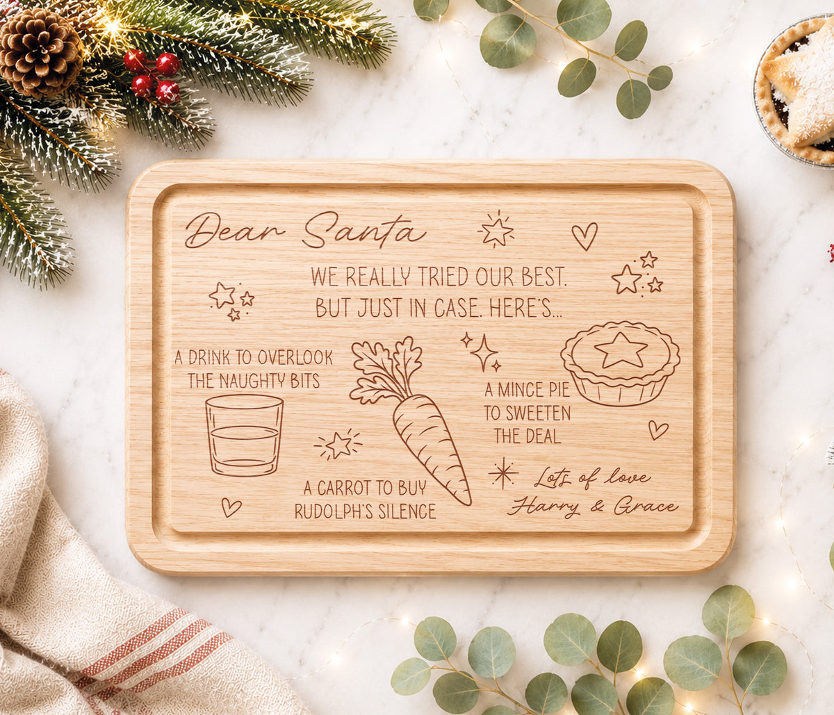 A funny Christmas Eve board for Santa's treats. With the message 'Dear Santa we really tried our best, but just in case, here's...'  A drink to overlook the naughty bits, a carrot to buy rudolph's silence and a mince pie to sweeten the deal. With love the childrens names.