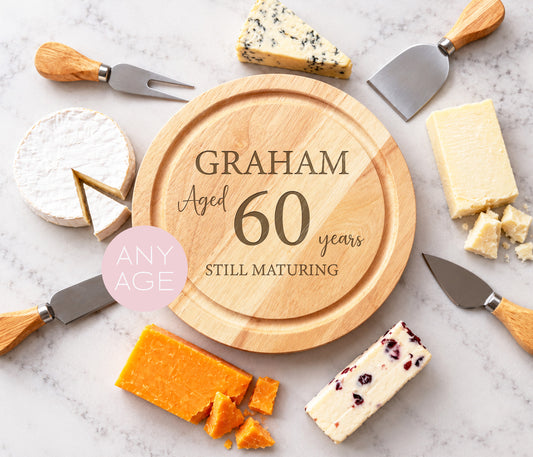Personalised Cheeseboard, with the wording Graham, ages 60 years, still maturing.